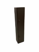 Brown steel gun cabinet for four guns with ammunition rack on back of door