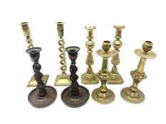 Three pairs of Victorian and later brass candlesticks