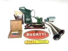 Bugatti cast iron sign with a red background