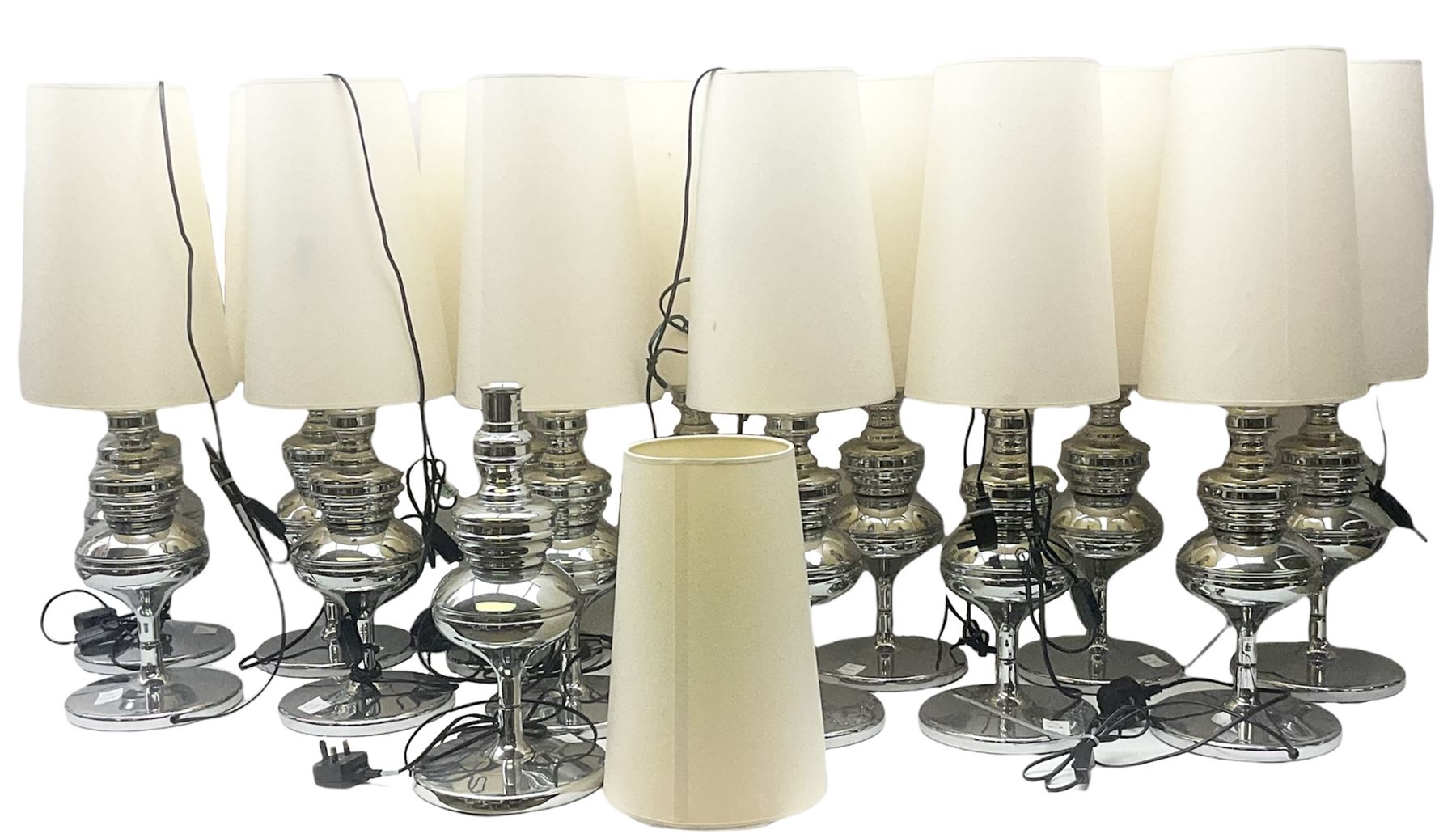 fourteen chrome table lamps with cream fabric shades
