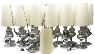 fourteen chrome table lamps with cream fabric shades