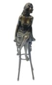 Art Deco style bronze figure of a semi-nude lady seated on a stool
