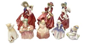 Eight Royal Doulton figures