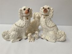 Pair of Staffordshire style spaniels and others similar