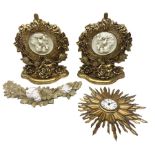 Pair of gilt wall brackets with composite relief in the centre