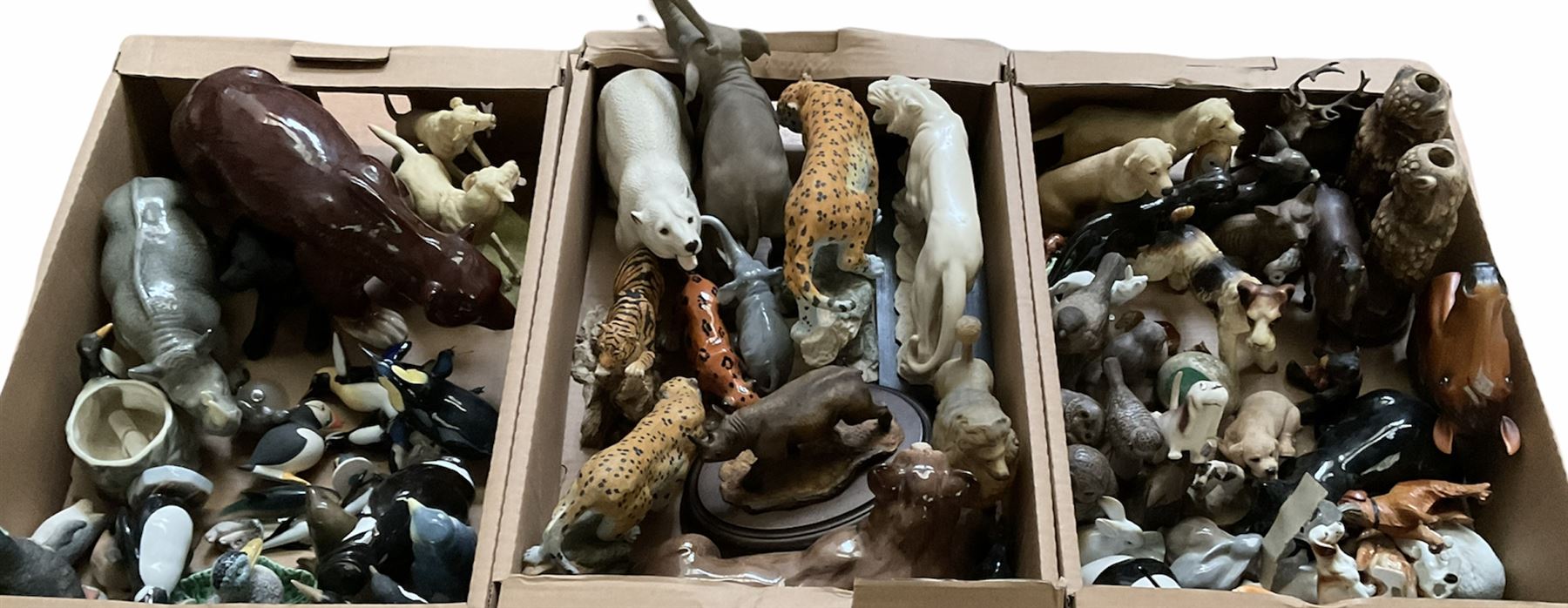 Three boxes of animal figures to include mainly ceramic and composite examples