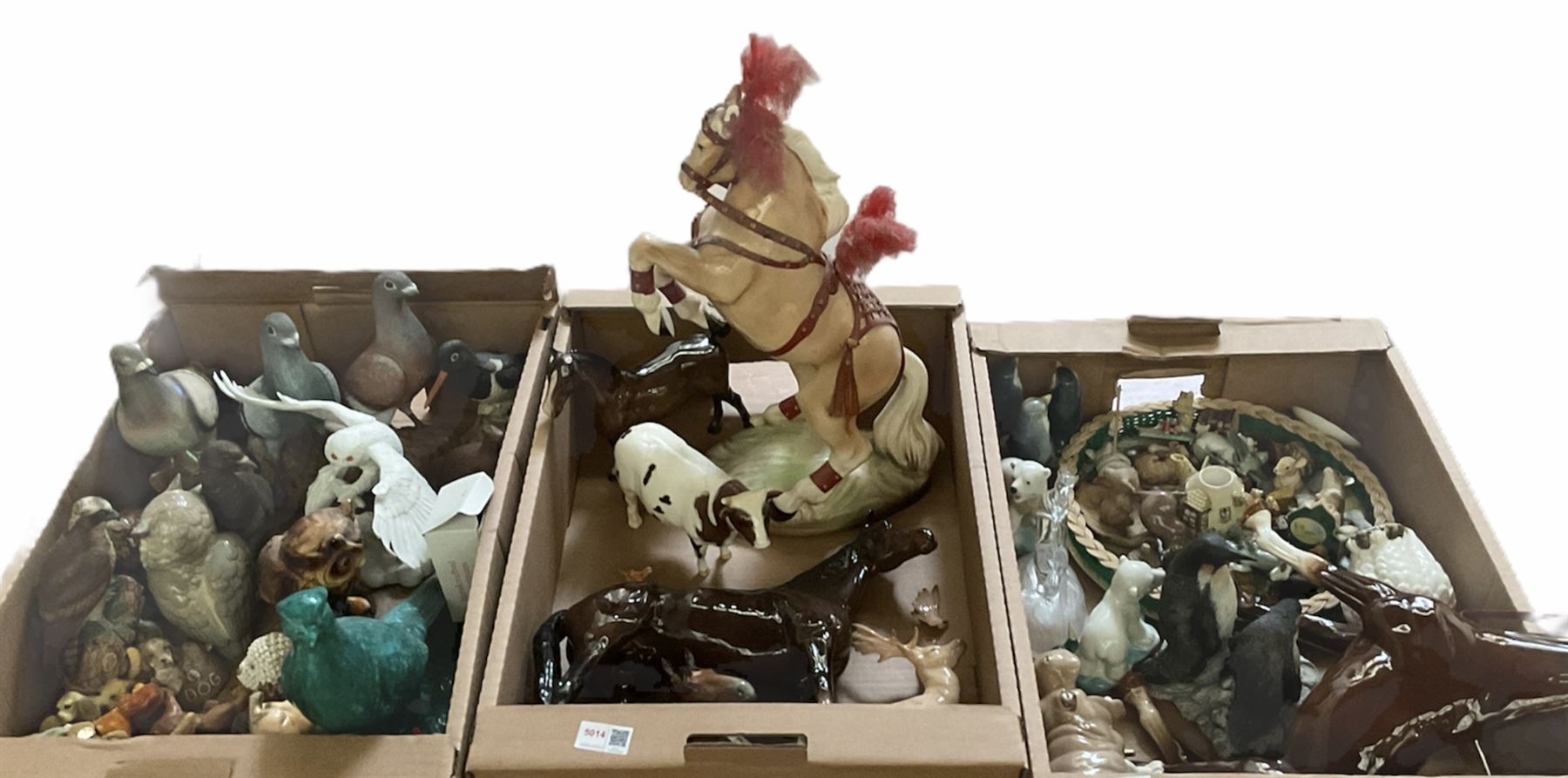 Three boxes of animal figures to include mainly ceramic and composite examples