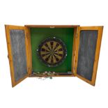 Dart board in wooden cabinet