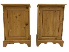 Two small pine bedside cupboards