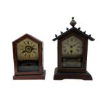 An American spring driven 30-hour 19th century timepiece shelf clock in a wooden case with a gable t