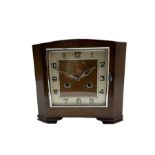 A 1930'S Art Deco 8-day striking mantle clock in a rectangular oak case on raised feet