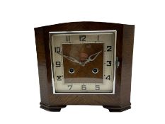 A 1930'S Art Deco 8-day striking mantle clock in a rectangular oak case on raised feet