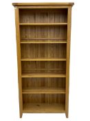 Tall light oak bookcase
