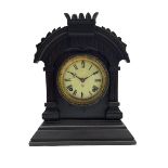 An American Ansonia 8-day striking mantle clock c1880 in a carved ebonised wooden case