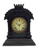 An American Ansonia 8-day striking mantle clock c1880 in a carved ebonised wooden case