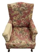 Early 20th century beech framed upholstered wing back armchair