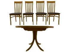 Light oak circular extending dining table and four chairs