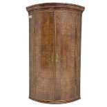 Yew wood bow front corner cupboard