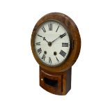 A late 19th century American drop dial wall clock in a walnut case