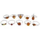 Ten silver amber rings