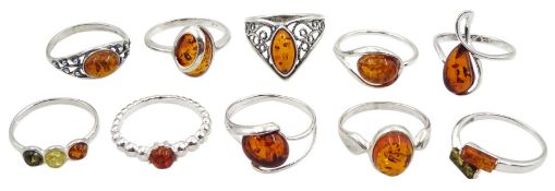 Ten silver amber rings