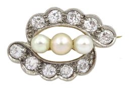 Early 20th century 18ct gold and palladium ten stone diamond and three stone pearl cross over brooch