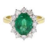 18ct gold oval emerald and round brilliant cut diamond cluster ring