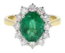 18ct gold oval emerald and round brilliant cut diamond cluster ring