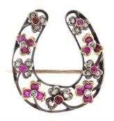 Victorian silver and gold horseshoe brooch set with rose cut diamonds and rubies