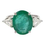 18ct white gold three stone oval emerald and trilliant cut diamond ring