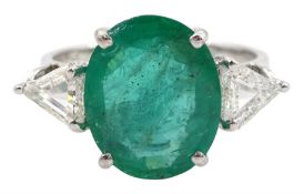 18ct white gold three stone oval emerald and trilliant cut diamond ring