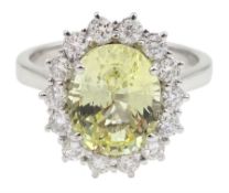 18ct white gold oval yellow sapphire and round brilliant cut diamond cluster ring