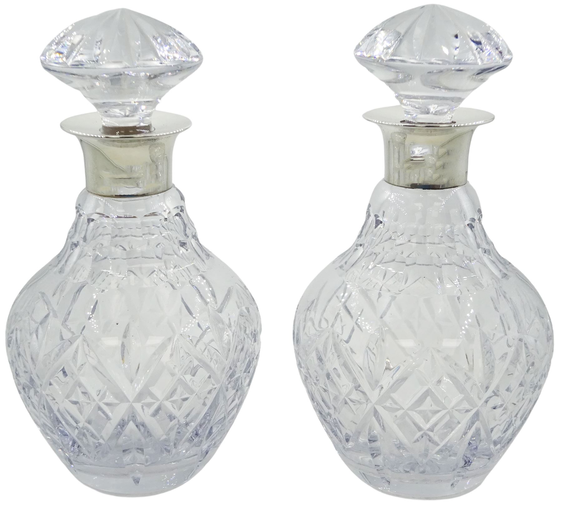 Pair of modern silver mounted Royal Doulton cut glass decanters
