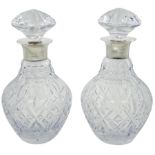 Pair of modern silver mounted Royal Doulton cut glass decanters