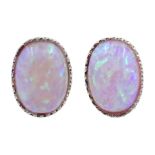 Pair of silver oval opal earrings