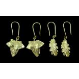 Pair of 18ct gold oak leaf design pendant earrings and one other pair of 18ct gold leaf earrings