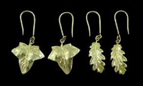 Pair of 18ct gold oak leaf design pendant earrings and one other pair of 18ct gold leaf earrings