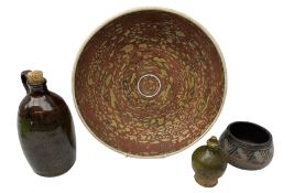 Group of studio pottery to include shallow bowl of ochre and terracotta colour pallete with flaked d