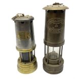 Two miners lamps comprising an E Thomas & Williams Ltd example and a Lamp & Limelight Company exampl