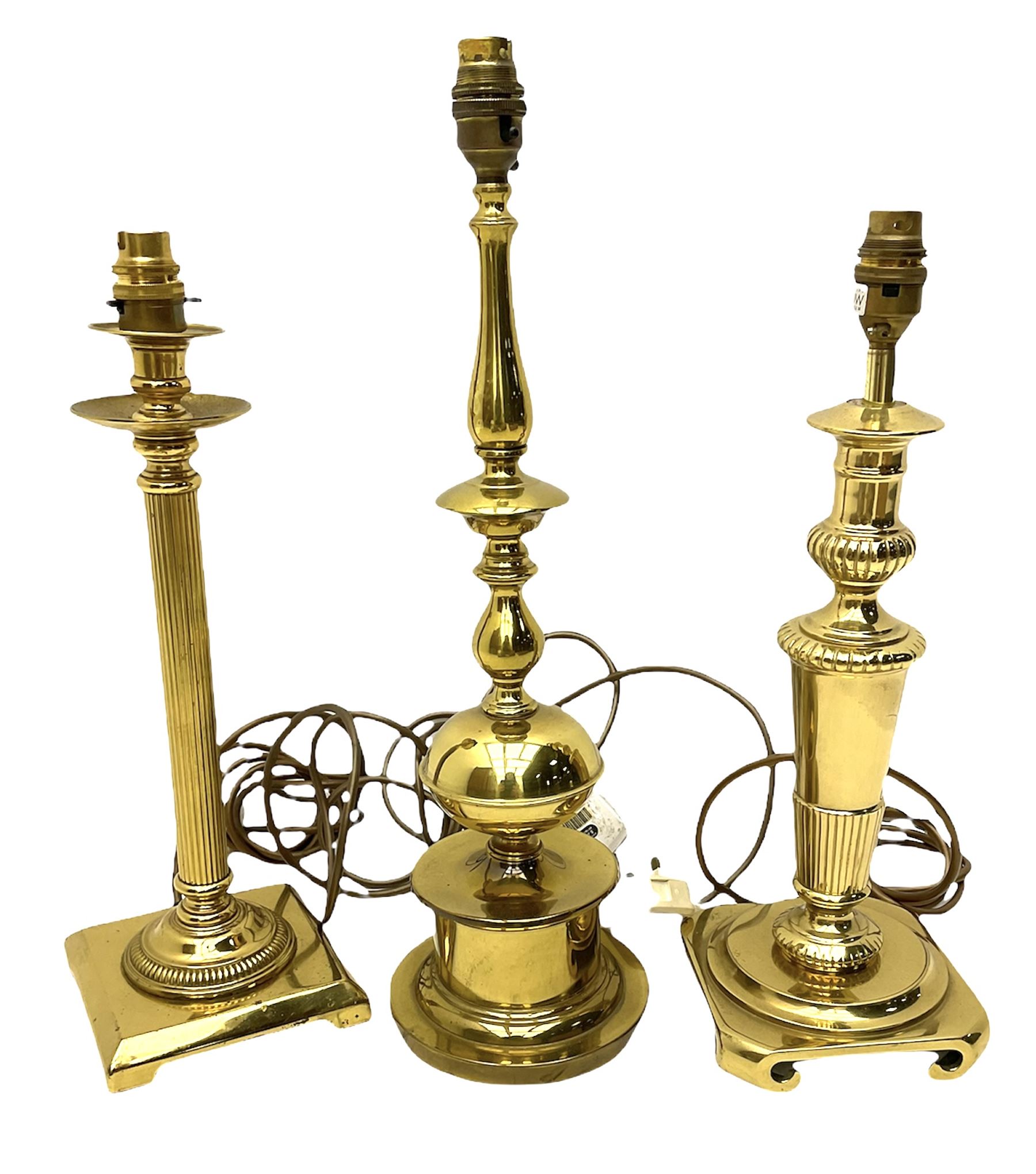 Three brassed table lamps