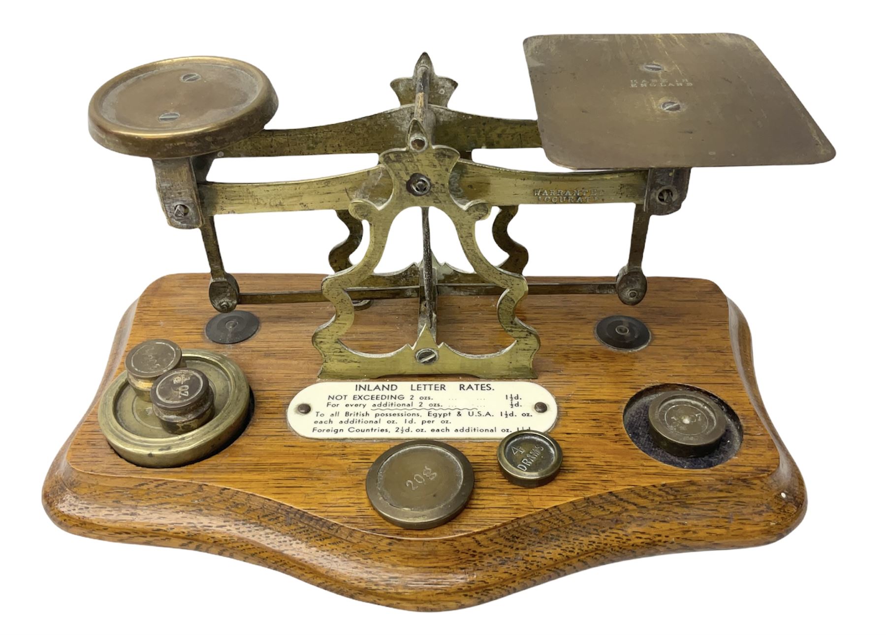 Brass postage scales on shaped moulded mahogany base