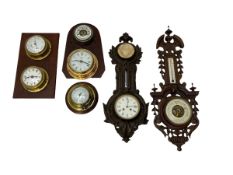 A selection of barometers and wall clocks