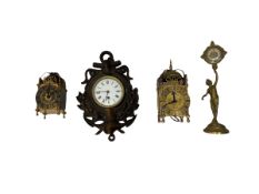 Three mantle clocks and a wall clock