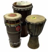 Three wooden and hid bongo drums