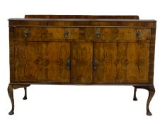 Early 20th century figured walnut bow front sideboard