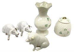 Two Royal Copenhagen figures modelled as seated pigs