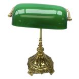 Brass bankers lamp with green glass shade on ornate base