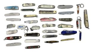 Thirty-four pocket knives including advertising