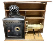 19th Century brass and tin magic lantern mounted upon a wooden base