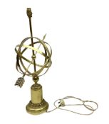 Armillary table lamp with an arrow piercing the central orb